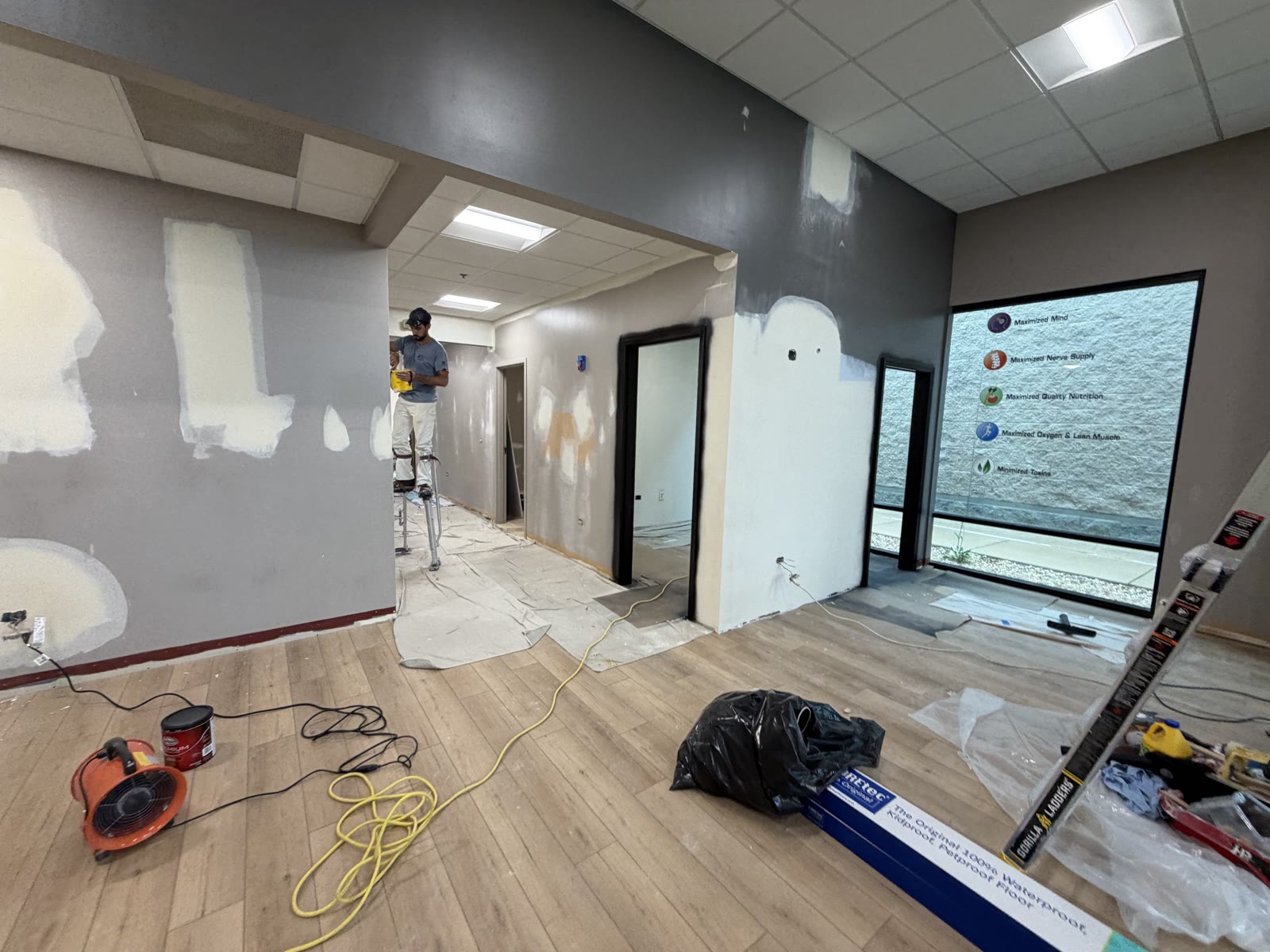 Painting on stilts during renovation
